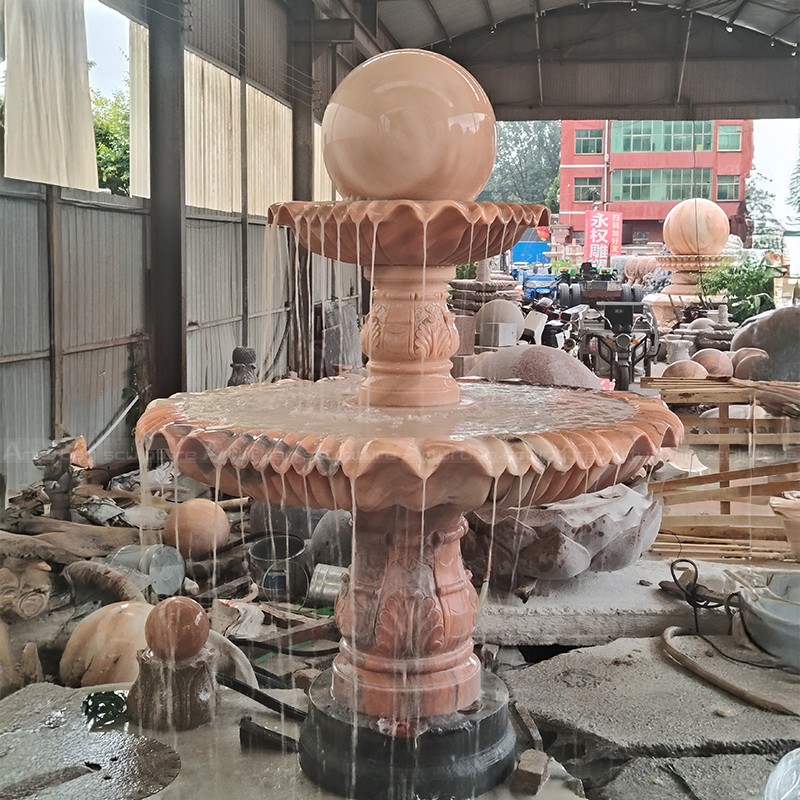 Large Tiered Fountain beside marble lotus fountain