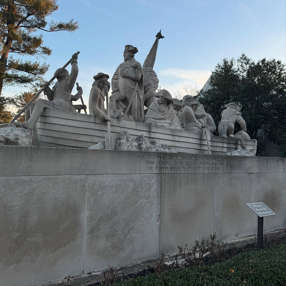 Limestone Delaware crossing sculpture with twelve figures