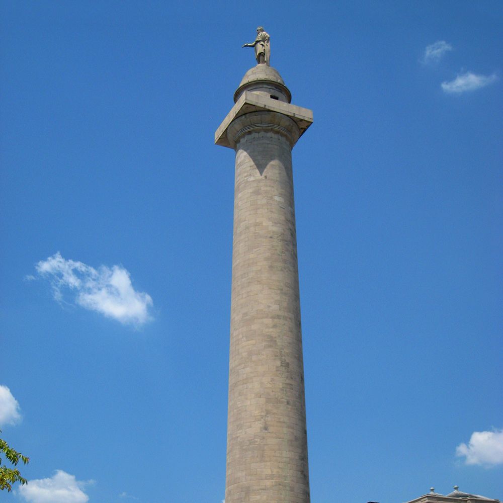 Marble Washington column rising against blue sky