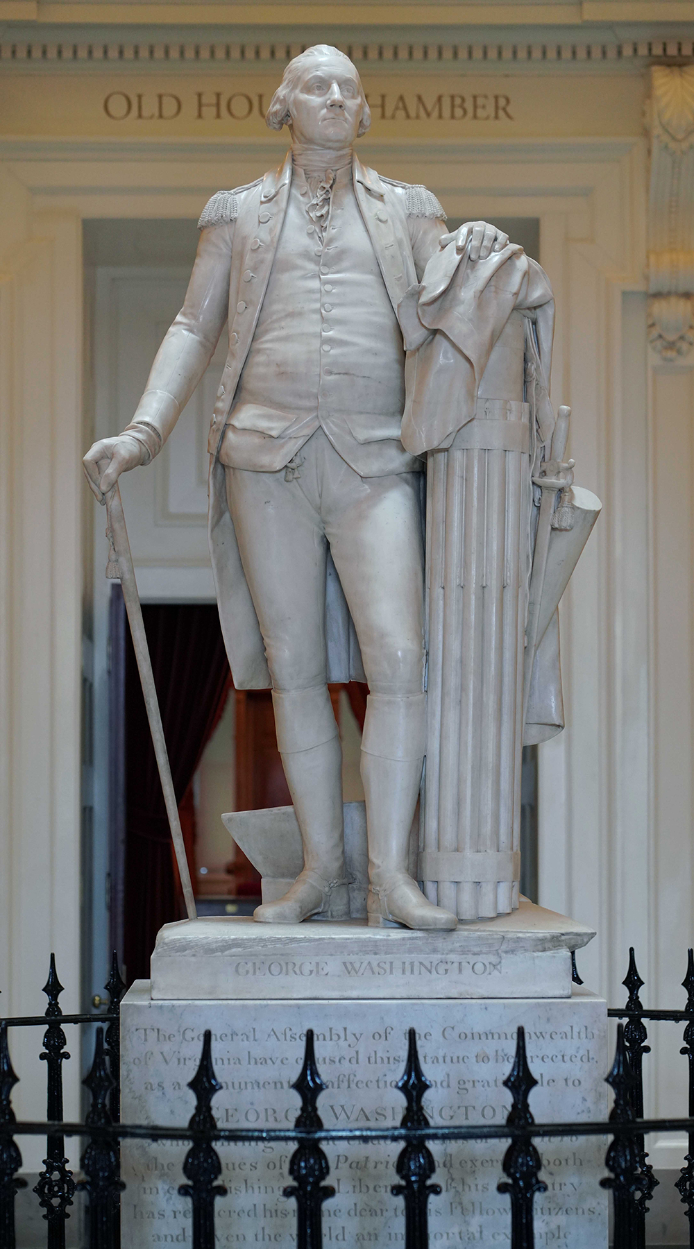 Marble Washington standing with cane and fasces