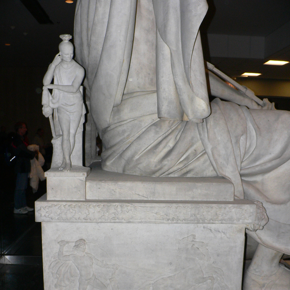 Marble allegorical figure on Washington throne side