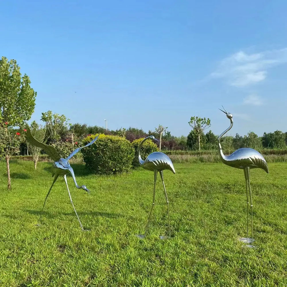 Metal Crane Yard Art flock in garden
