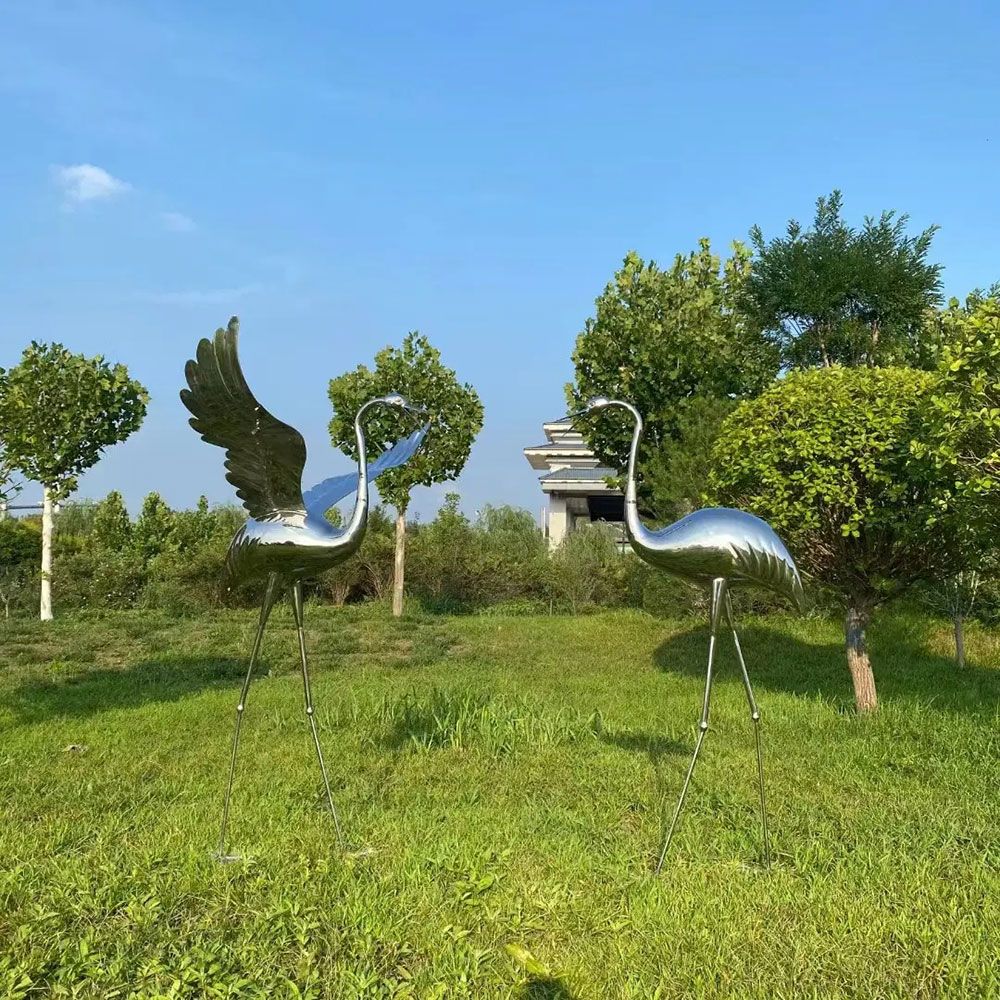 Metal Crane Yard Art standing on lawn