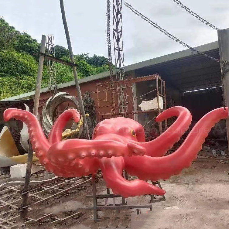 Red fiberglass Octopus Garden Sculpture with curling tentacles