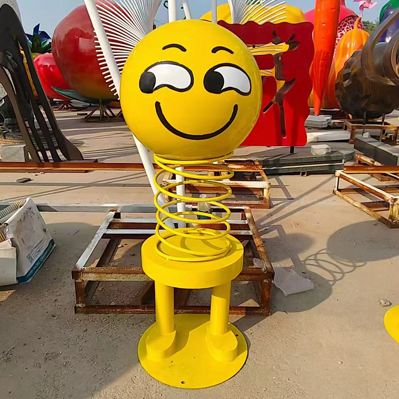 Stainless steel Smiley Face Statue side glance