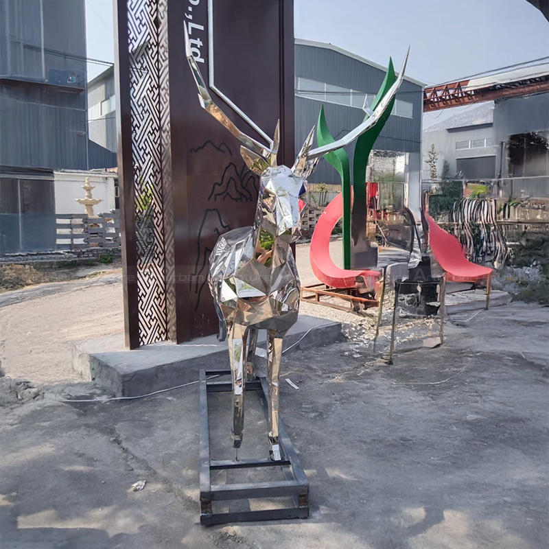 Stainless steel deer sculpture with tall antlers
