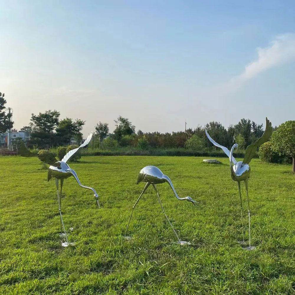 Three Metal Crane Yard Art figures