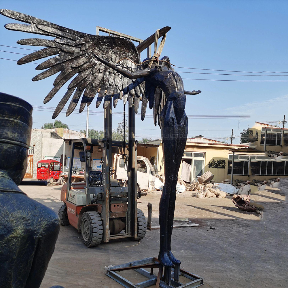 Winged Figure Sculpture bronze elongated body detail