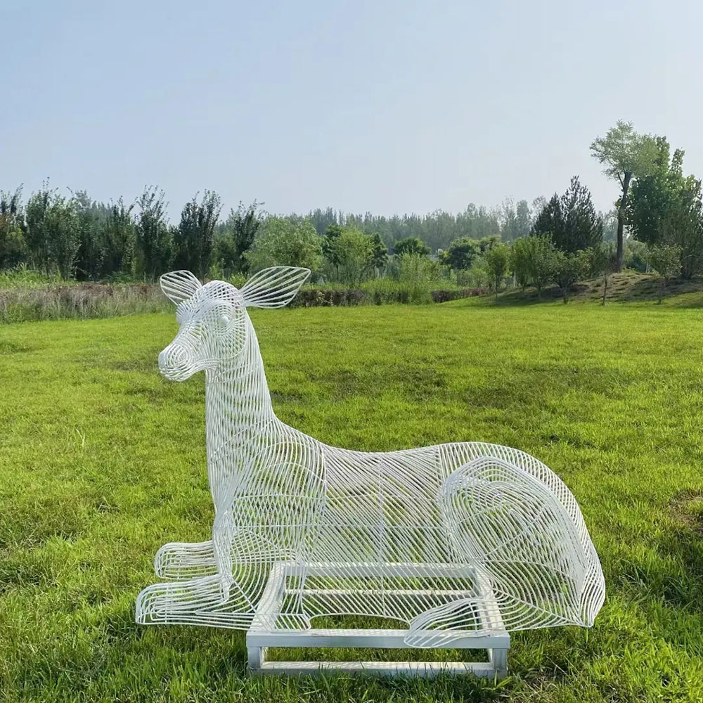 Wire Deer Statue resting on garden lawn