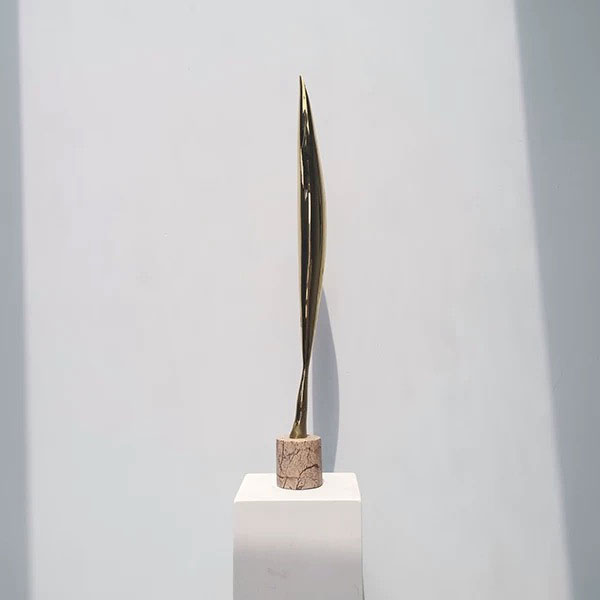 4 Curved brass abstract bird sculpture on marble