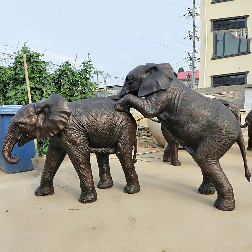 Bronze African Elephant Sculpture Featuring Two Playful Calves