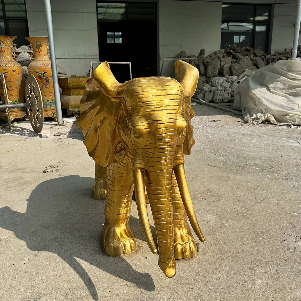 Golden Elephant Sculpture with Bronze Tusks and Trunk