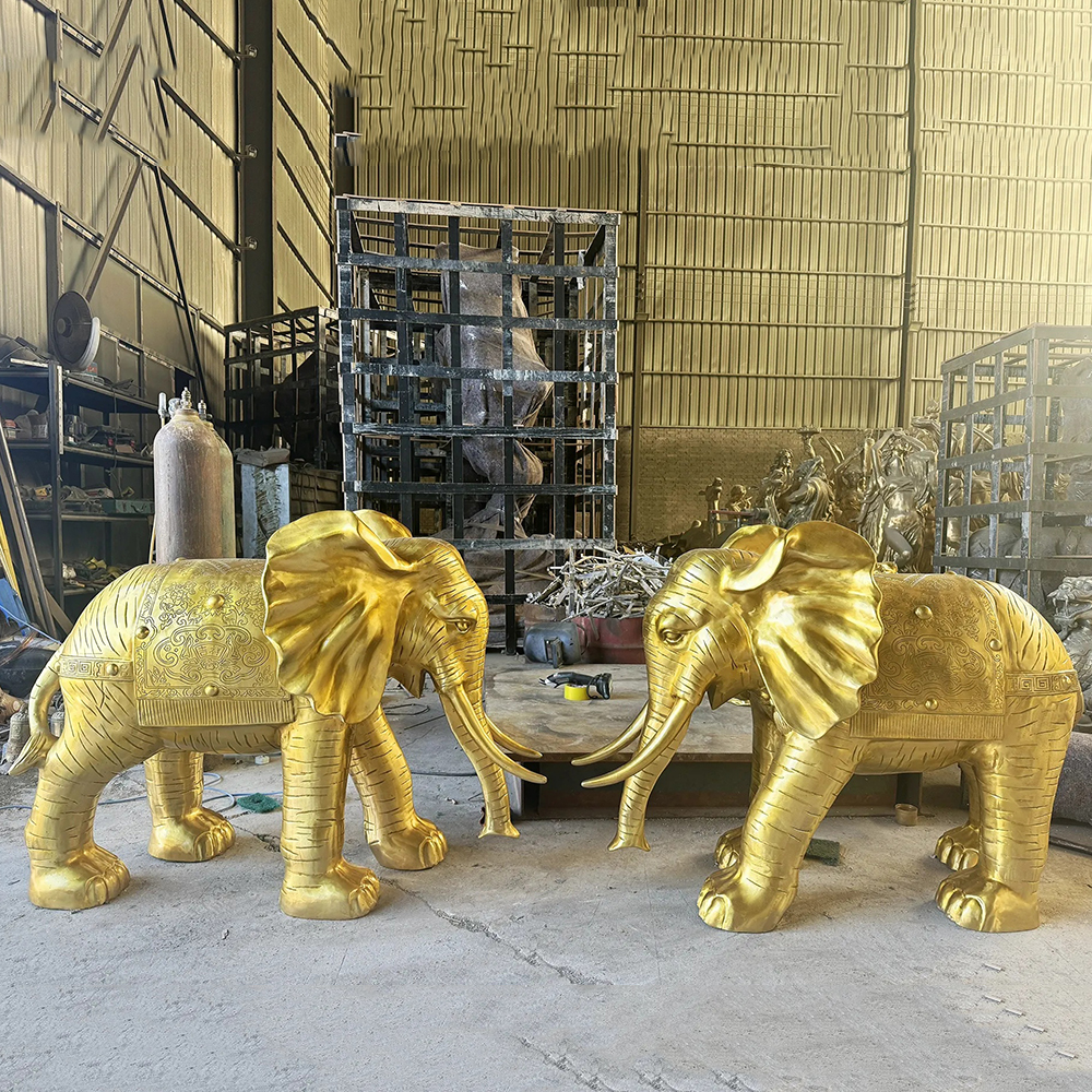 Pair of Golden Elephant Sculptures with Decorative Blankets