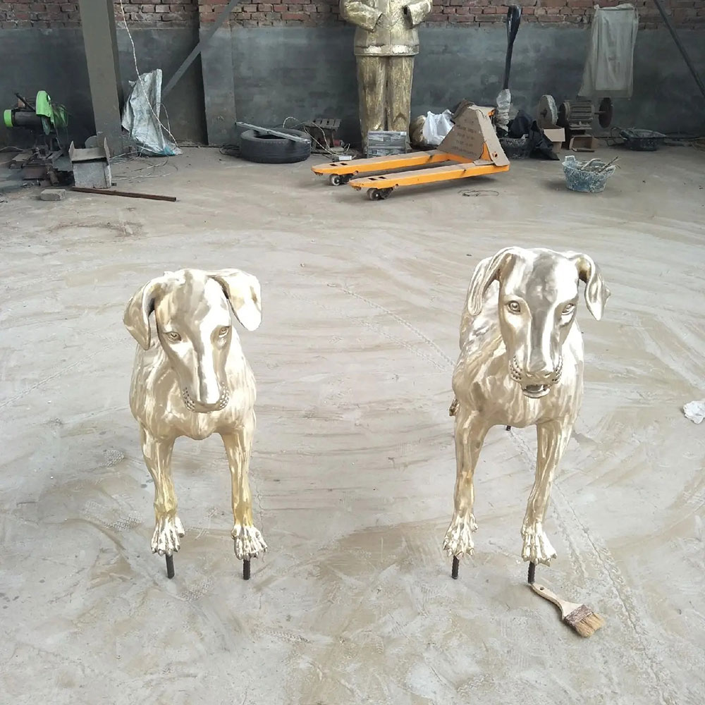 Pair of Polished Bronze Doberman Yard Statues