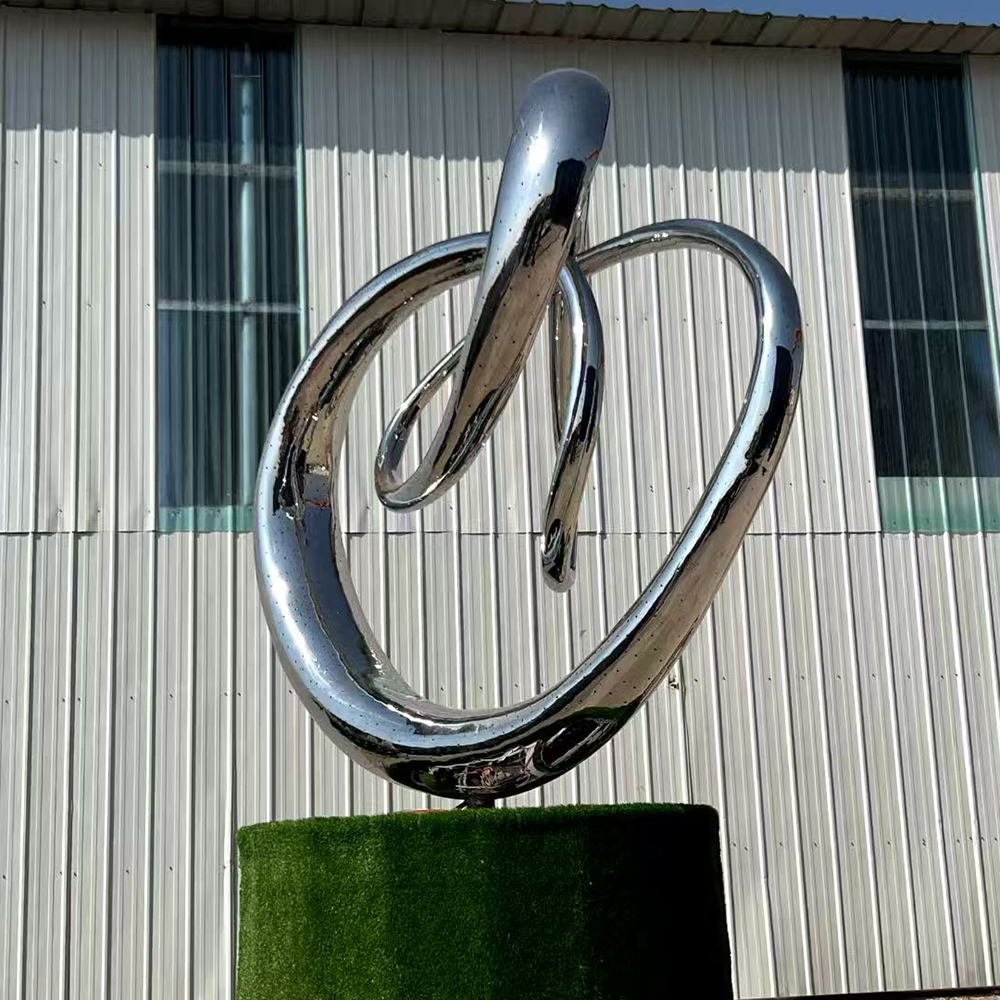 Stainless Steel Loop Statue on Garden Pedestal