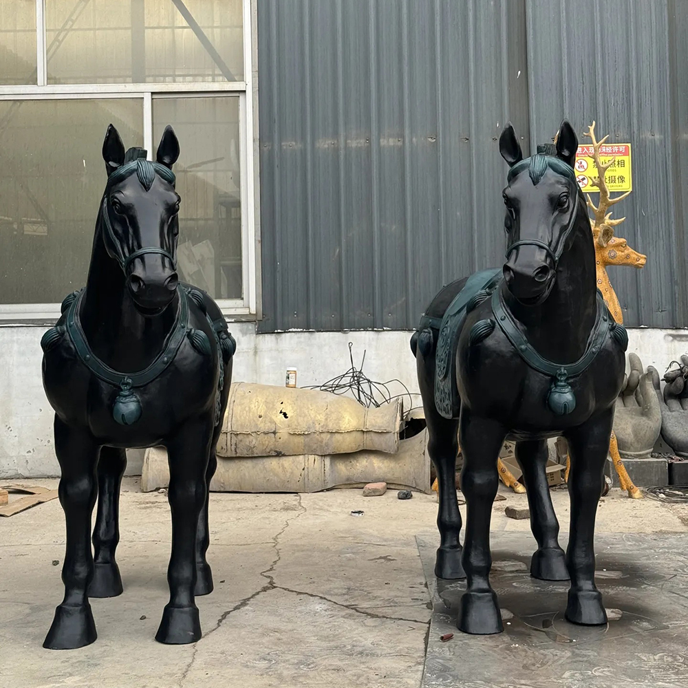 Two Oriental Horse Statues with Ornate Saddles